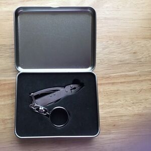 Miniature tool keychain in a health care advertisement silver tin box.
